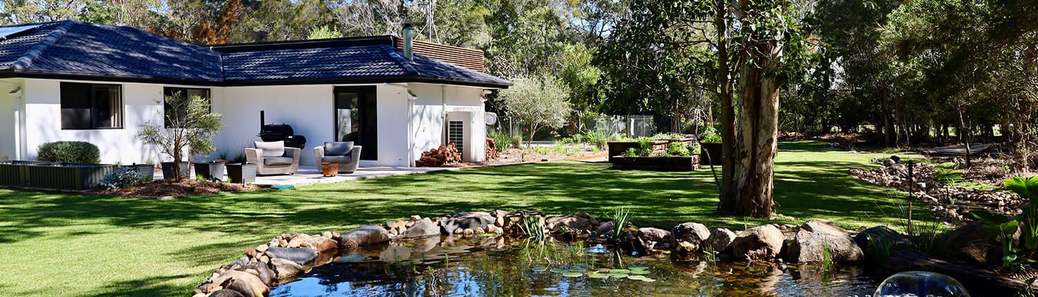 Chandler pond and edible gardens, Turning a boring acreage property into a lush landscape with water features.