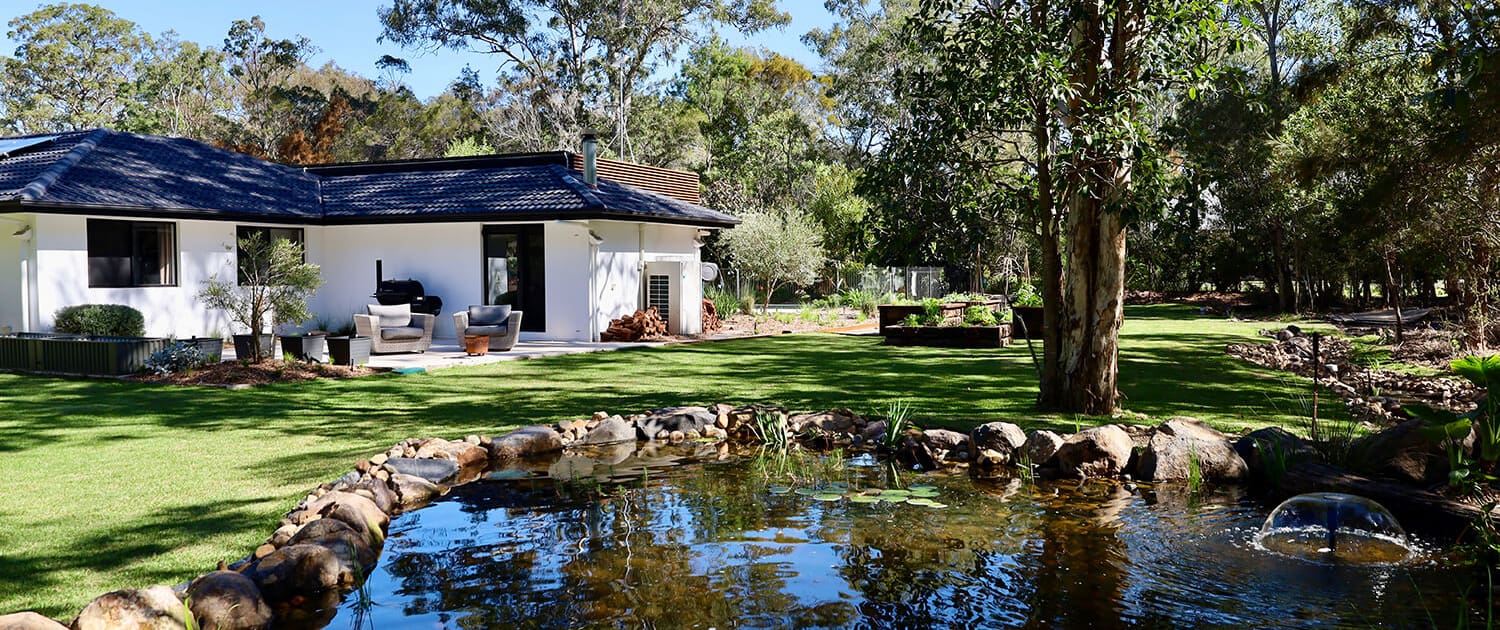 Chandler pond and edible gardens, Turning a boring acreage property into a lush landscape with water features.