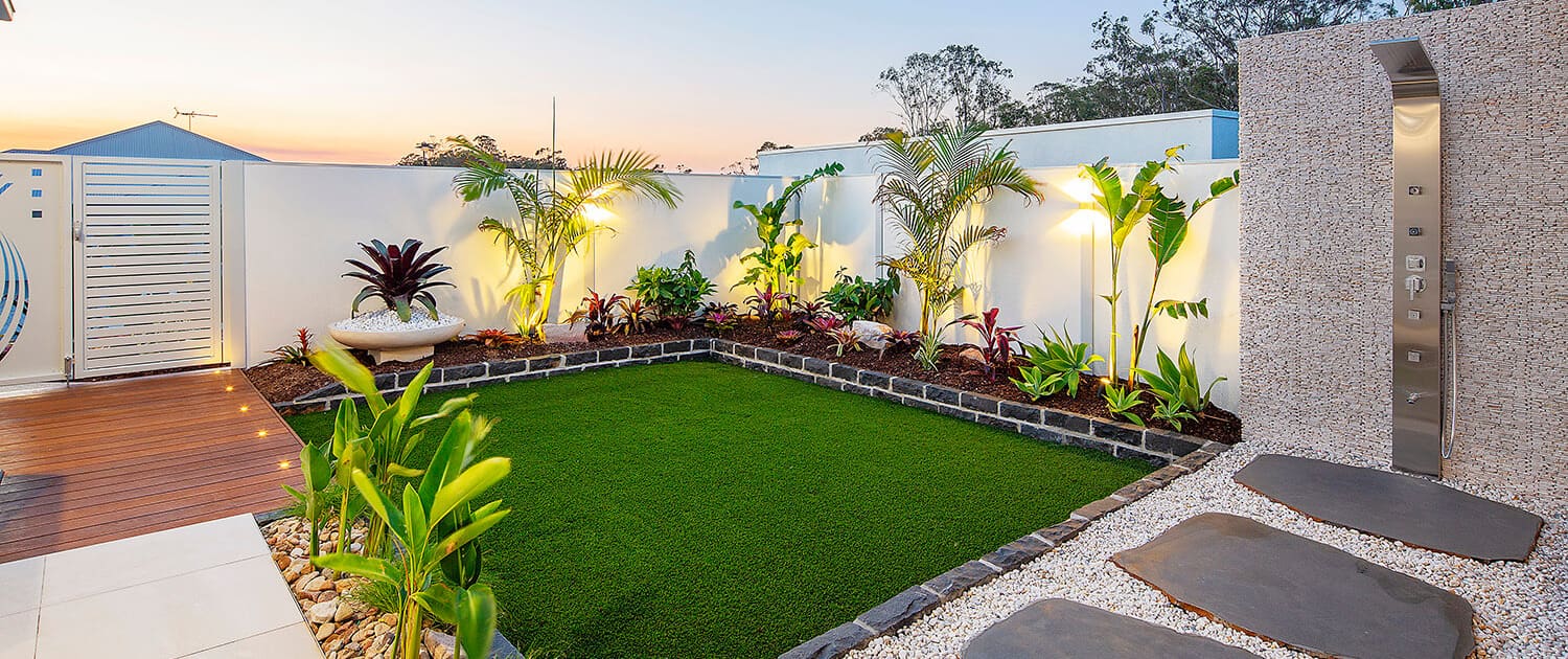 Turf incorporated into Landscape Design modern backyard in residential home Brisbane